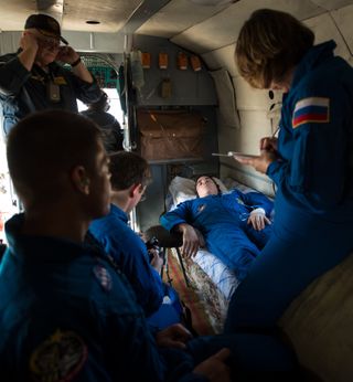 Cassidy Rest Aboard Helicopter After Soyuz Landing
