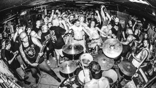 Hardcore band Terror playing live surrounded by fans