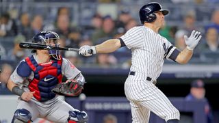 Brett Gardner #11 of the New York Yankees hits a grand slam as Christian Vazquez #7 of the Boston Red Sox defends in the seventh inning at Yankee Stadium on April 17, 2019 in New York City. Credit: Elsa/Getty