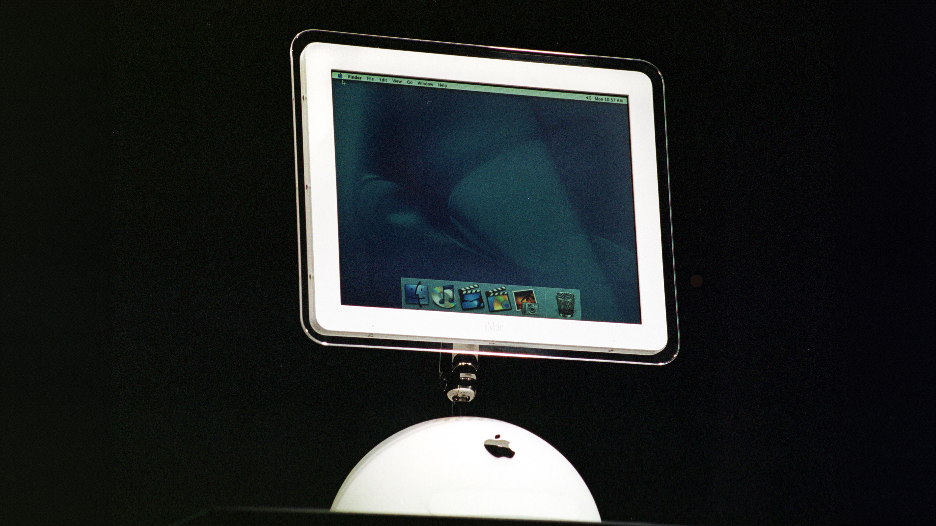 The iMac G4 sitting on a black background at Macworld