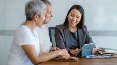 A senior couple in a meeting with their financial adviser