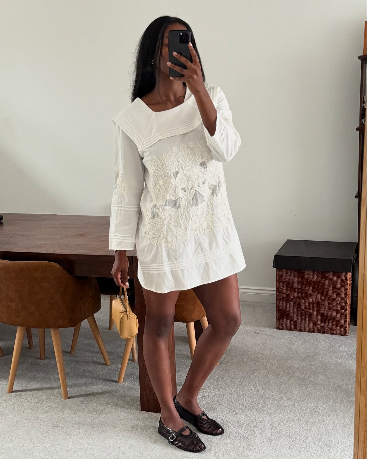 @Nlmarilyn wearing mary jane flats with a white mini dress.