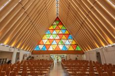 jnterior of Christchurch Cardboard Cathedral by Shigeru Ban with coloured glass side