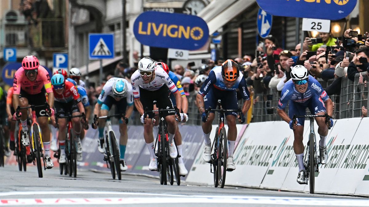 Jasper Philipsen crossing the finish line first in the 2024 Milan-San Remo race