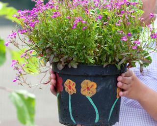 flower pot decorated and planted by a child