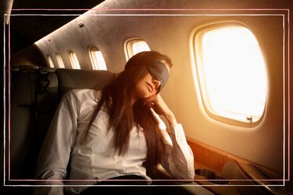 sleep on a plane illustrated by woman wearing an eye mask while sat next to a plane window