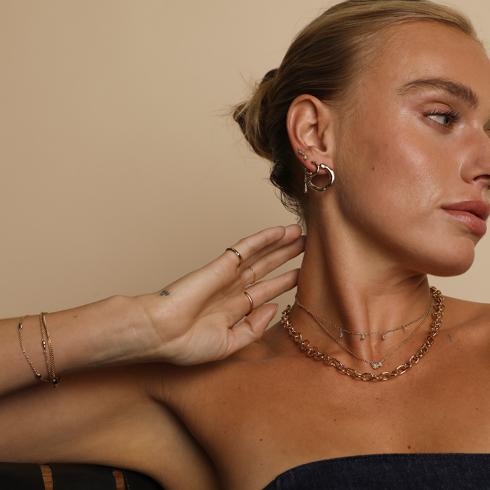 Model wearing mixed metal jewellery sold at Astrid & Miyu