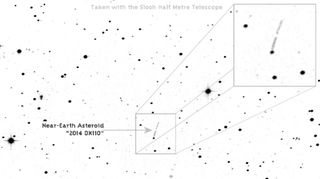 The asteroid 2014 DX110 is identified in this image from a Slooh half-meter telescope during the asteroid's close flyby of Earth on March 5, 2014. The 100-foot asteroid passed within 217,000 miles of Earth.