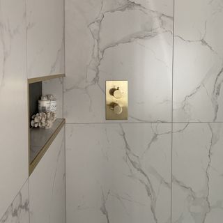 large format tiles and brass shower controls