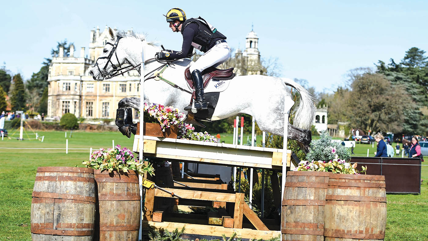 Tom Rowland and Dreamliner clear a table on the cross-country at Thoresby with the house behind.