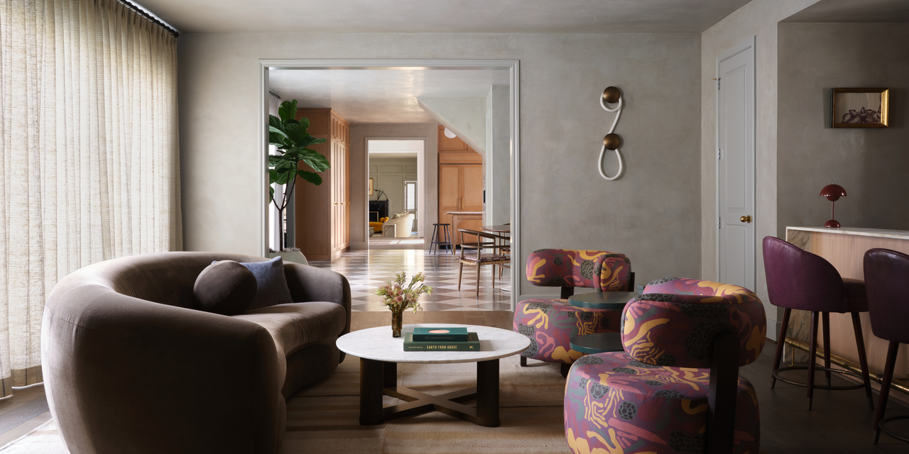 modern living room with a brown couch and purple patterned chairs