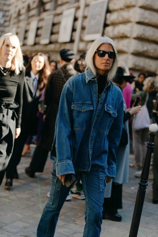 Woman at Fashion Week wearing a denim jean jacket