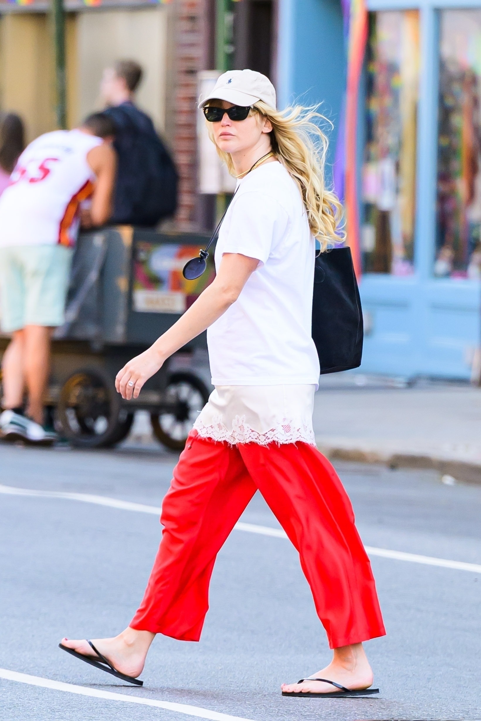 Jennifer Lawrence paired her suede Liffner bag with a lace-trimmed tunic and flip-flops