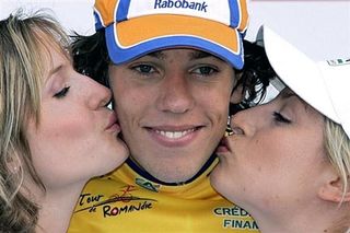 Winner of the Tour of Romandie, Thomas Dekker (Rabobank) of the Netherlands smiles while he receives kisses.