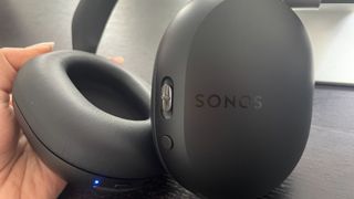 Sonos Ace headphones in black finish close up of logo