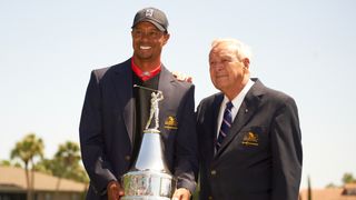 Tiger Woods with Arnold Palmer after winning the 2013 trophy