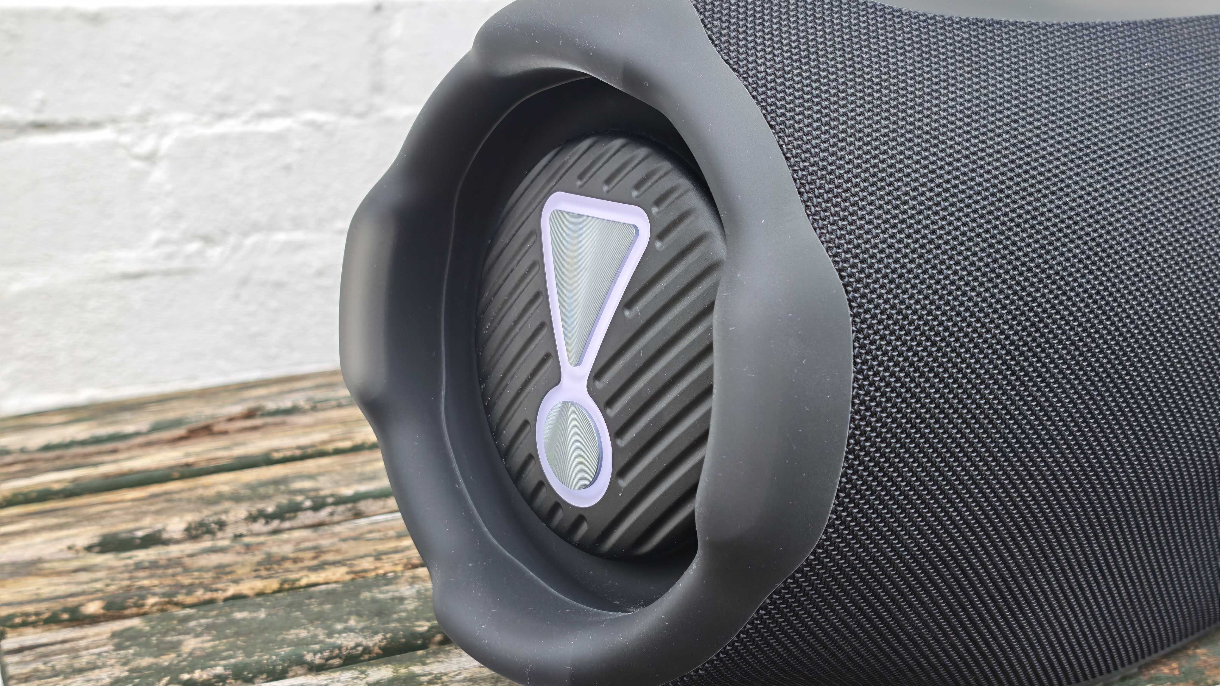 The JBL Boombox 4 on a table outside.
