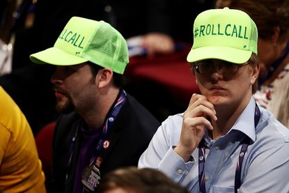 Delegates wear roll call hats.