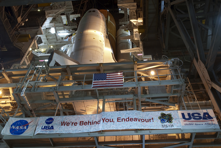 Space shuttle Endeavour begins its slow move from High Bay 3 in the Vehicle Assembly Building to Launch Pad 39A at NASA&#039;s Kennedy Space Center in Florida.