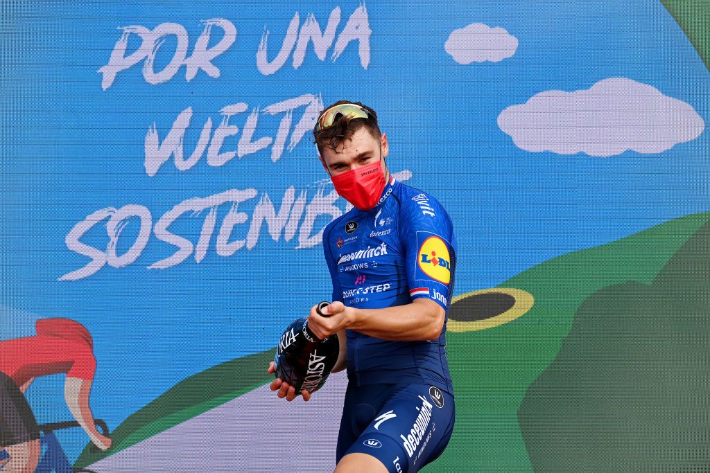LA MANGA SPAIN AUGUST 21 Fabio Jakobsen of Netherlands and Team Deceuninck QuickStep celebrates winning the stage on the podium ceremony after during the 76th Tour of Spain 2021 Stage 8 a 1737 km stage from Santa Pola to La Manga del Mar Menor lavuelta LaVuelta21 on August 21 2021 in La Manga Spain Photo by Stuart FranklinGetty Images