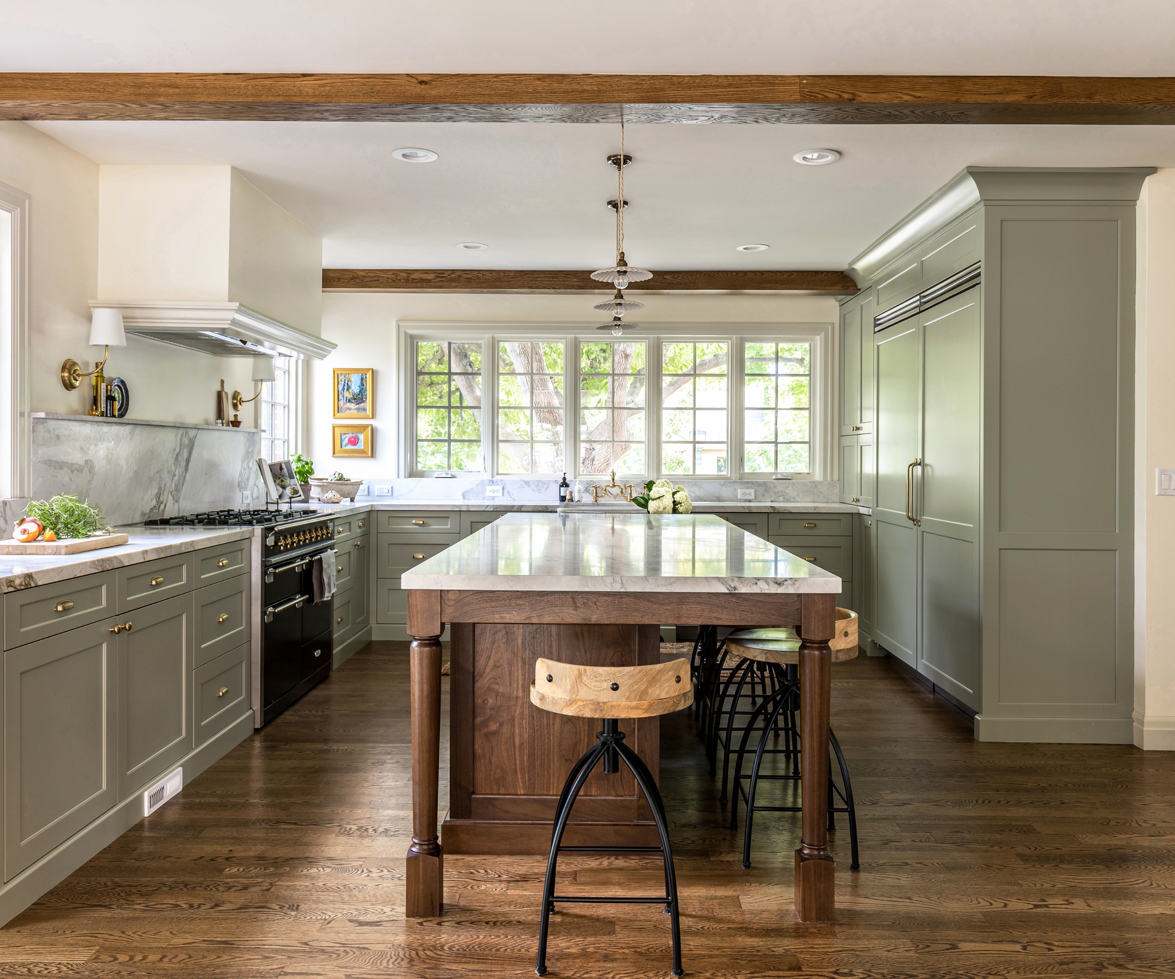 A U-shaped kitchen with cabinets painted French Gray by Farrow &amp;amp; Ball
