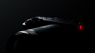 Teaser image of a new Canon camera, hidden in shadow