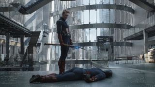 Cap looking down at his younger self after knocking him out in Endgame