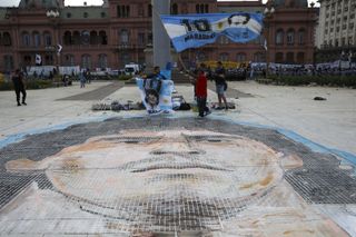 A mosaic of the face of Diego Maradona is painted on Plaza de Mayo, in front of the presidential palace in Buenos Aires
