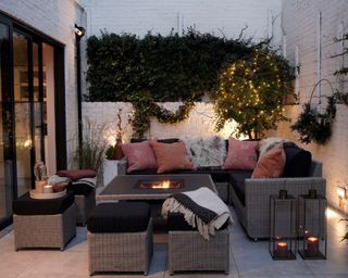 Outdoor space with rattan garden furniture and firepit
