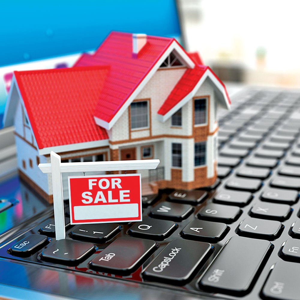 white house toy with red roofing and wooden windows on keyboard