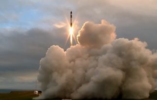 Rocket Lab's first Electron booster launches into space from the Mahia Peninsula in New Zealand on May 25, 2017. The rocket's upper stage failed to reach its intended orbit, company representatives said.