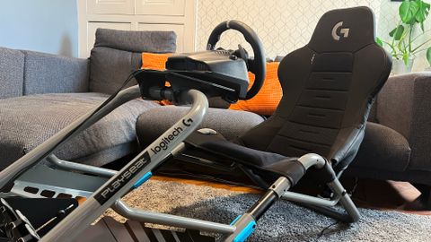 Playseat Trophy Logitech G Edition hero image assembled in a living room sitting in front of a reviewer's couch