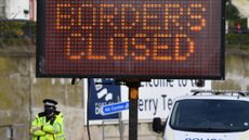 A sign informs drivers that the French border crossing is closed.