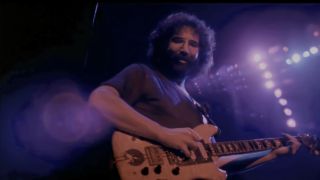 Jerry Garcia playing guitar in The Grateful Dead Movie