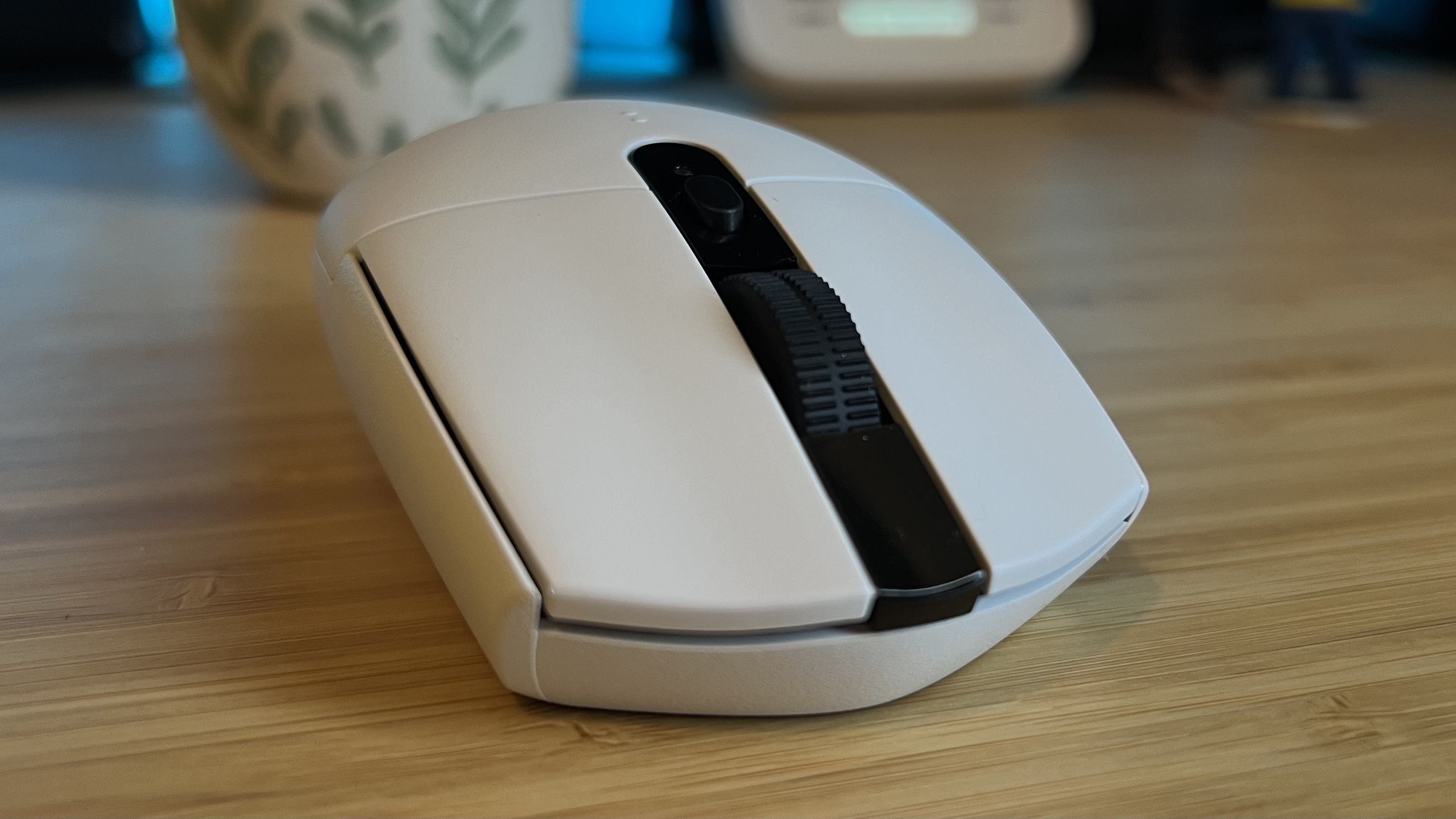 Front of Logitech G305 Lightspeed gaming mouse with main clicks facing the camera