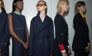 Female models wearing navy clothes with bright accents from the Jil Sander A/W 2015 collection