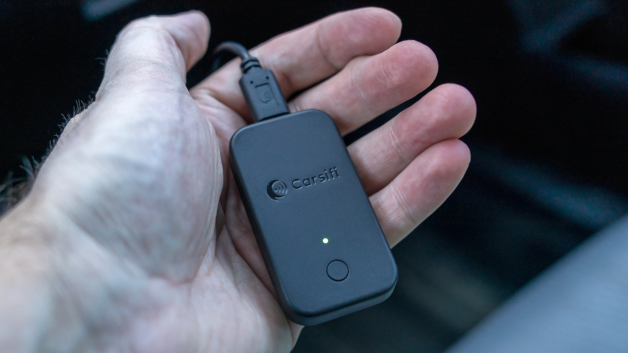 Carsifi Android Auto adapter on hand.