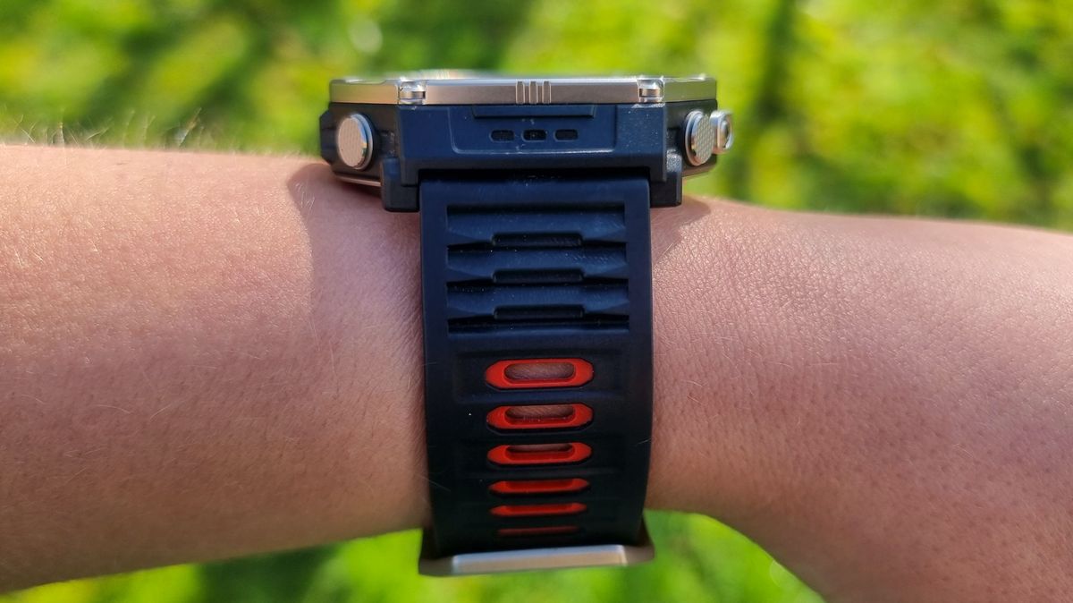 a close-up picture of our reviewer wearing the Amazfit T-Rex Ultra 2, a view from the side