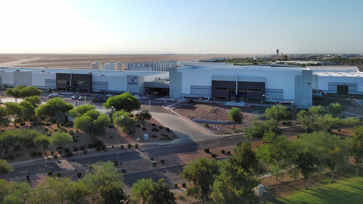 a large complex consisting of several large white buildings, seen from high in the air