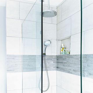 bathroom with shower and shampoo bottle