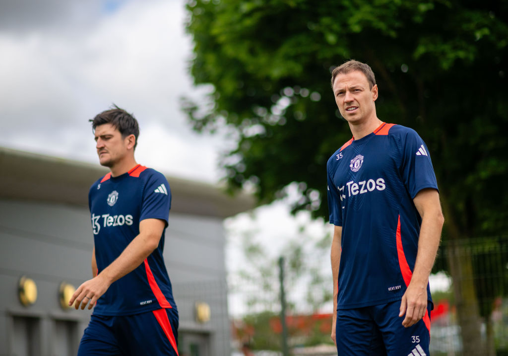 MANCHESTER, ENGLAND - JULY 22: Harry Maguire and Jonny Evans of Manchester United in action during a pre-season training session at Carrington Training Ground on July 22, 2024 in Manchester, England. (Photo by Ash Donelon/Manchester United via Getty Images)