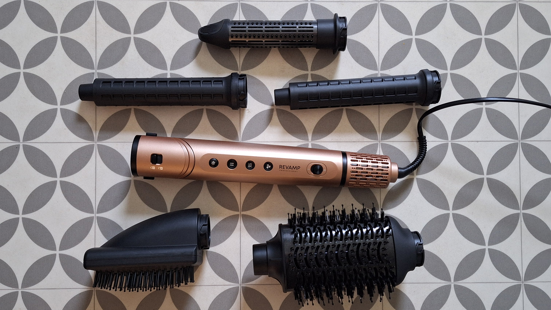 Revamp Dynamic Radiance Pro hair styler with all its attachments around it
