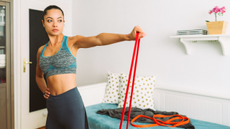 Woman doing arm exercises with resistance band