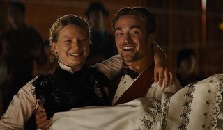 Damsel Mia Wasikowska Robert Pattinson all smiles with her in his arms