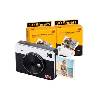 A black polaroid camera with two yellow boxes