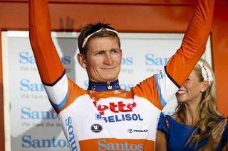 Andre Greipel pulls on the first leader's jersey at the Tour Down Under