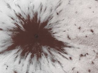 A large object such as a meteoroid hit near Mars' southern ice cap, puncturing the ice and creating a splat.