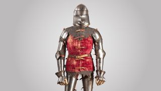 A photo of medieval plate armor that a "knight in shining armor" would wear.