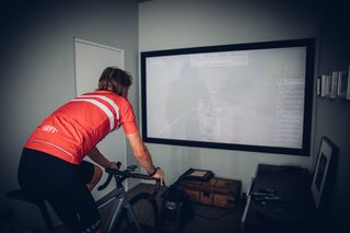 Image shows a rider warming up for cycling.
