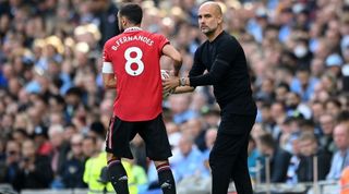 Pep Guardiola, Manager of Manchester City, and Bruno Fernandes of Manchester United interact during the Premier League match between Manchester City and Manchester United at Etihad Stadium on October 02, 2022 in Manchester, England.